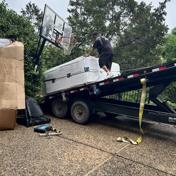 Muscleman Elite Moving & Storage - Lowering from the truck onto the plank ramp they built - Movers Near Me - Austin, Texas Muscleman Elite Moving & Storage - Lowering from the truck onto the plank ramp they built - Movers Near Me - Austin, Texas