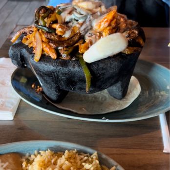 Plaza Azteca - This was a Molcajete Azteca Lunch which is stake and shrimp and chicken breast Rice and Refried Beans at the bottom - Mexican Near Me - Virginia Beach, Virginia
