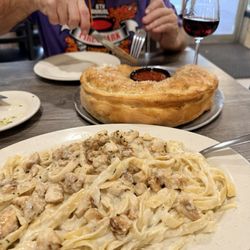 Famous Sal's Pizza & Italian Eatery - Fettuccine with grilled chicken, yes please!! Also comes with a salad and garlic knots!!