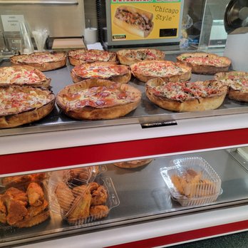 Reggio's - pizzas and pastries in a display case - Italian Near Me - Chicago, Illinois Reggio's - pizzas and pastries in a display case - Italian Near Me - Chicago, Illinois