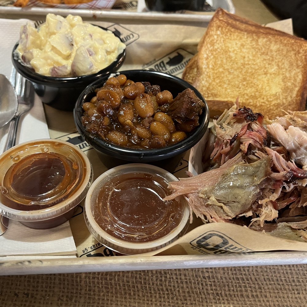 Community Q BBQ - Pulled Pork Platter with sides of baked beans and potato salad. - Barbeque Near Me - Decatur, Georgia