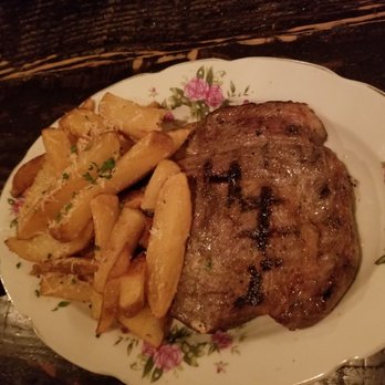 Chartier - Cut of beef special and garlic parmesan fries. - French Near Me - Beaumont, Alberta