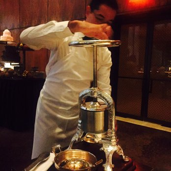 The Grill - Pressing the sauce - Cocktail Bars Near Me - New York, New York