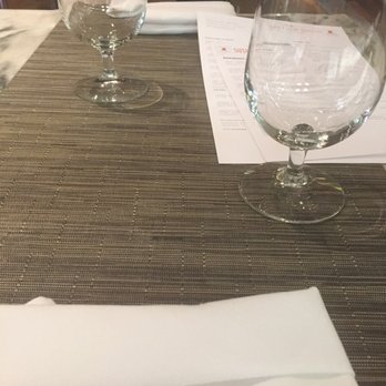 One Flew South - Table setting sans table cloths - New American Near Me - Atlanta, Georgia One Flew South - Table setting sans table cloths - New American Near Me - Atlanta, Georgia