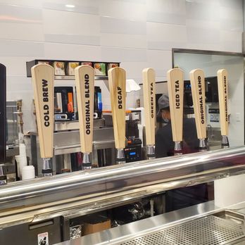 Dunkin' - a row of beer taps in a restaurant - Donuts Near Me - New York, New York Dunkin' - a row of beer taps in a restaurant - Donuts Near Me - New York, New York