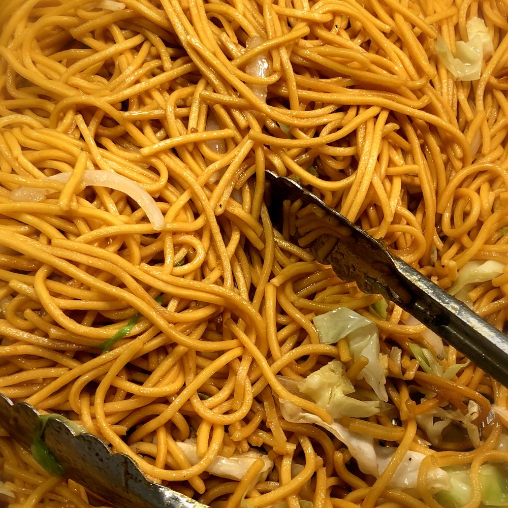 Brother Kitchen - a bowl of noodles with tongs - Chinese Near Me - Fontana, California Brother Kitchen - a bowl of noodles with tongs - Chinese Near Me - Fontana, California