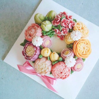 Bake People Happy - a cake decorated with flowers - Desserts Near Me