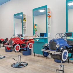 Piccolinos Haircuts - our little patrons get to pick a fire truck chair, a shark airplane, a blue antique car or a sweet pink airplane!