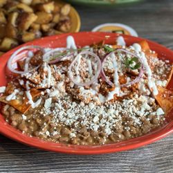 Mimosas Gourmet - Lodi - Chilaquiles w side of beans. Straight Fire.. I liked the beans better than the potatoes.