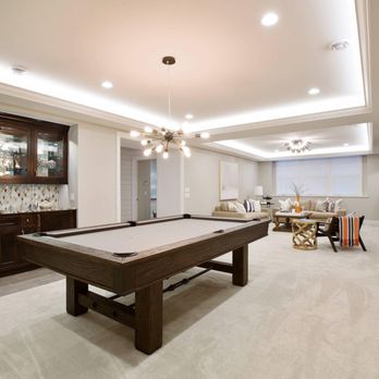 David Williams Electric - a pool table in the basement - Electricians Near Me