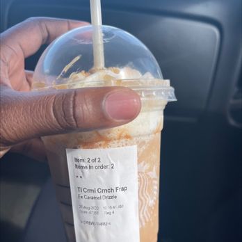 Starbucks - a hand holding a cup of iced coffee - Coffee & Tea Near Me - Augusta, Georgia Starbucks - a hand holding a cup of iced coffee - Coffee & Tea Near Me - Augusta, Georgia