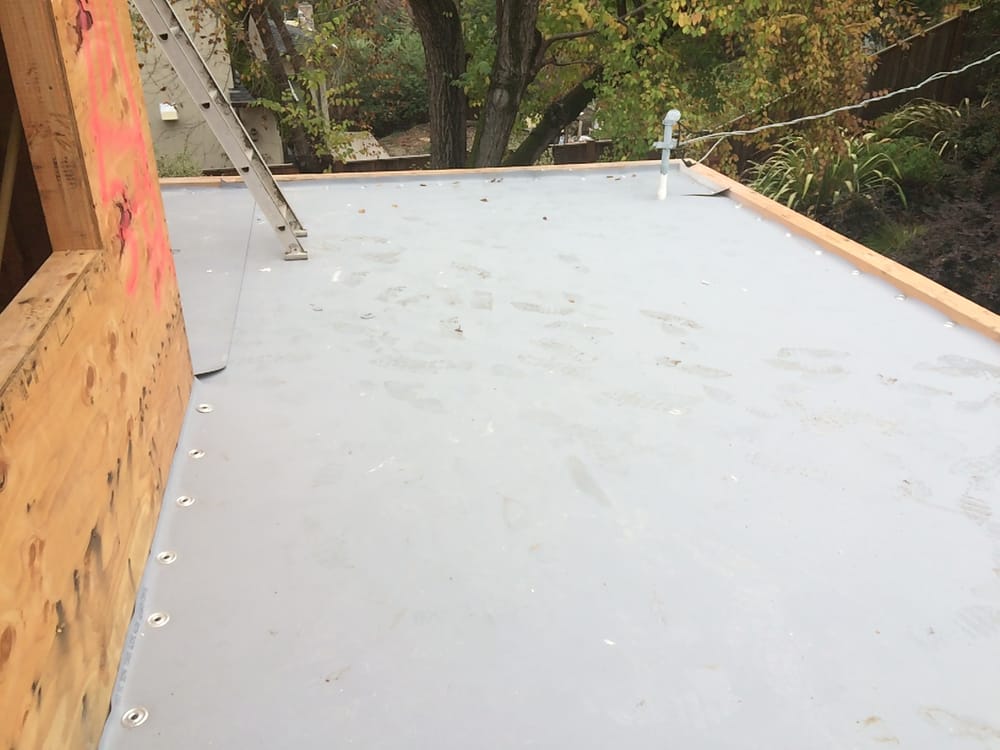 Slide of Caruzo's Roofing Contractors