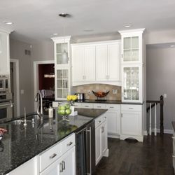 Alexander Painting & Construction - Kitchen cabinets changed from stained pecan color to oil based paint (white).