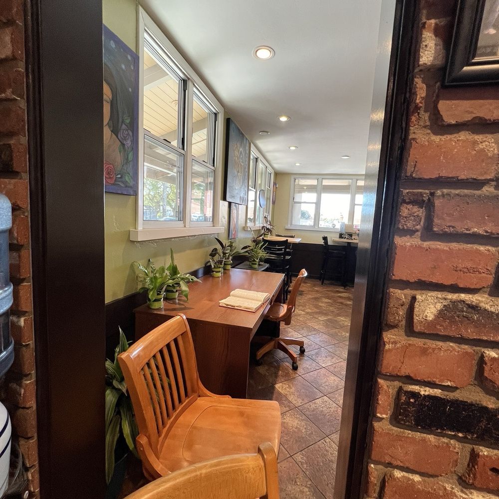 Coffeetopia - a view of a coffee shop through a doorway - Coffee & Tea Near Me - Santa Cruz, California