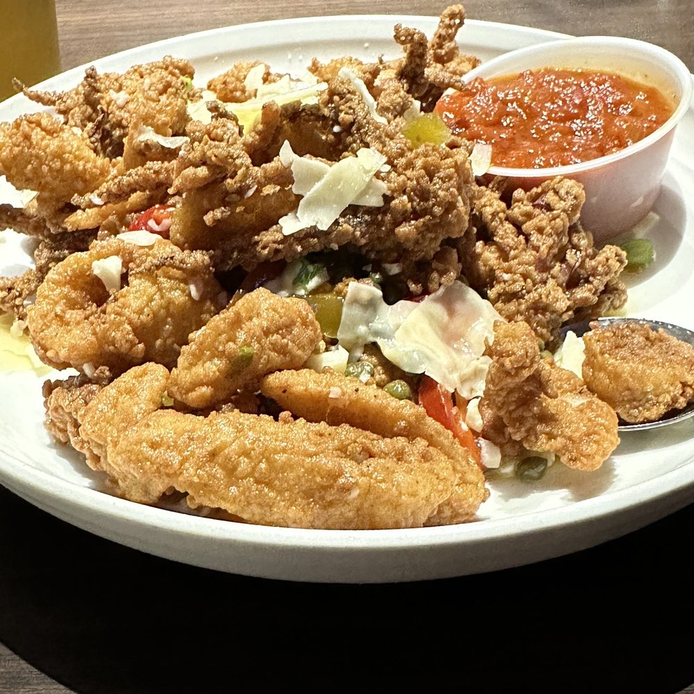 The Yarde Tavern - Calamari with capers, hot cherry peppers and shaved provolone. - American Near Me - Enfield, Connecticut The Yarde Tavern - Calamari with capers, hot cherry peppers and shaved provolone. - American Near Me - Enfield, Connecticut