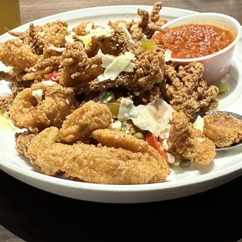 The Yarde Tavern - Calamari with capers, hot cherry peppers and shaved provolone. - American Near Me - Enfield, Connecticut The Yarde Tavern - Calamari with capers, hot cherry peppers and shaved provolone. - American Near Me - Enfield, Connecticut