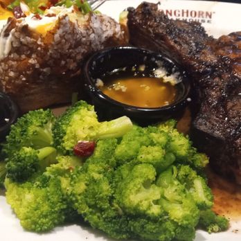 LongHorn Steakhouse - Outlaw Ribeye with broccoli and loaded baked potato - Steakhouses Near Me - Fleming Island, Florida LongHorn Steakhouse - Outlaw Ribeye with broccoli and loaded baked potato - Steakhouses Near Me - Fleming Island, Florida