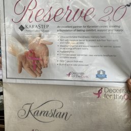 a person holding a sign that says reserve 20