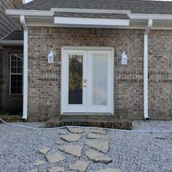 All Star Gutters - Side of home with two custom downspouts and a water diverter