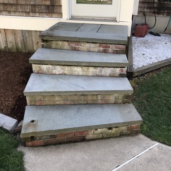Dan Driscoll - Back steps, bricks are crumbling and stained from mortar washing away over the years. - General Contractors Near Me
