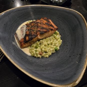 Eurasia Cafe - Grilled Atlantic Salmon: Israeli couscous, peas, fennel pollen, fresh basil, lemon pesto, beurre blanc - New American Near Me - Virginia Beach, Virginia Eurasia Cafe - Grilled Atlantic Salmon: Israeli couscous, peas, fennel pollen, fresh basil, lemon pesto, beurre blanc - New American Near Me - Virginia Beach, Virginia