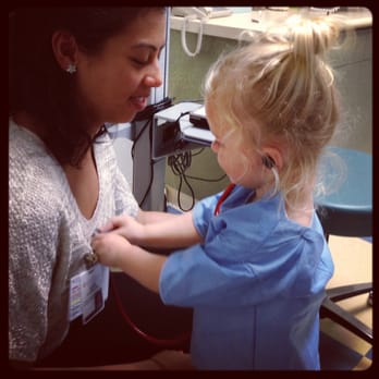 Sarah A. Hemmer, MD - Samuelle checking the assistant nurse's heart rate... - Pediatricians Near Me Sarah A. Hemmer, MD - Samuelle checking the assistant nurse's heart rate... - Pediatricians Near Me