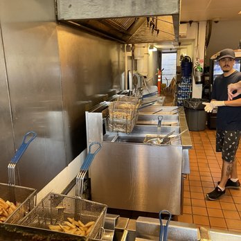 Thrasher's French Fries - a woman standing in a kitchen - Fast Food Near Me - Rehoboth Beach, Delaware