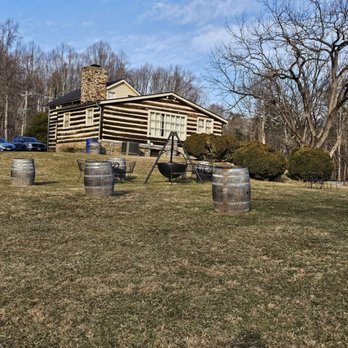 Paradise Springs Winery - Outside with historical cabin. - Wineries Near Me - Clifton, Virginia