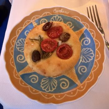 Carbone Riviera - Bread they bring out with roasted tomatoes and olives - Italian Near Me - Las Vegas, Nevada