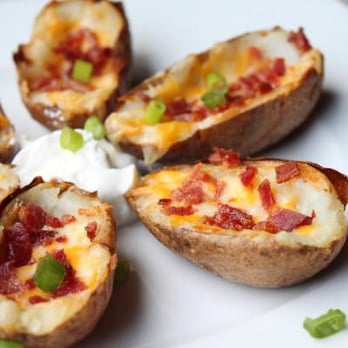 Dakotas Restaurant - a plate of loaded baked potatoes - American Near Me - Blanchard, Oklahoma