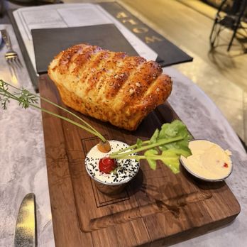 Wolf by Vanderpump at Caesars Republic Lake Tahoe - Famous pull apart bread! Must have! I think it's better than the goat cheese balls - American Near Me - Stateline, Nevada