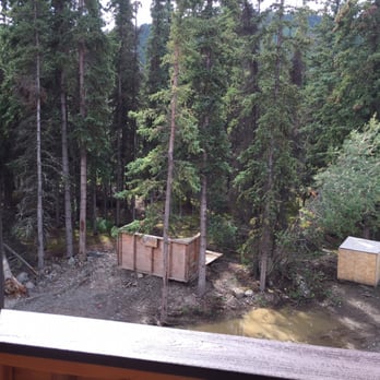 Denali Park Village - This is the view outside our room. We were told river front view. We are next to the highway and looking at construction junk. - Resorts Near Me - Denali, Alaska