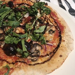Food - the vegetarian pizza tasted good  . The crust could be slightly thinner but the toppings compensated Service - BLA  Ambience -quirky