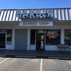 Doug's Barber Shop - The outside of Doug's Barber Shop.  Free parking available.