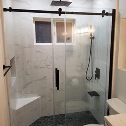 New bathroom, removed tub, installed rain shower, niche, and shower door