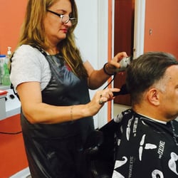 Angela's Place Barber, Beauty, & Stuff - Angela taking great care of one her returning customers!