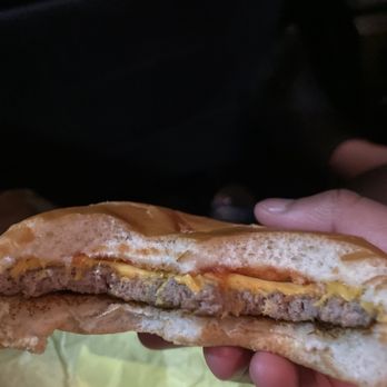 McDonald's - a hand holding a half eaten sandwich - Coffee & Tea Near Me - Ft. Myers, Florida McDonald's - a hand holding a half eaten sandwich - Coffee & Tea Near Me - Ft. Myers, Florida