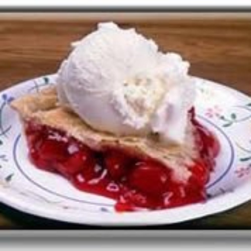 a cherry pie with ice cream on top a cherry pie with ice cream on top