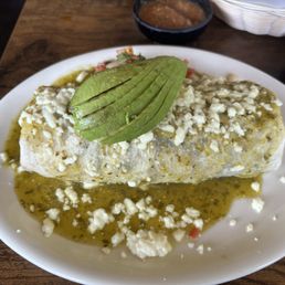 Carne Asada super burrito with green sauce Carne Asada super burrito with green sauce