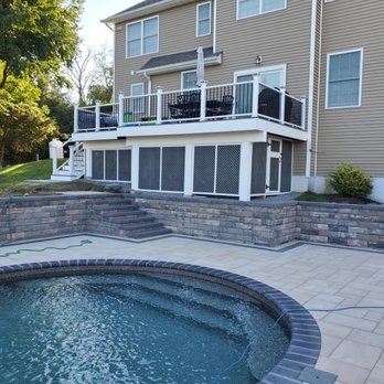 Exterior Services - a pool and patio with a deck - Landscaping Near Me - Danbury, Connecticut
