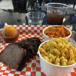 Brisket plate with mac n cheese, candied yams, and corned bread Brisket plate with mac n cheese, candied yams, and corned bread