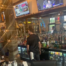 a man standing at the bar a man standing at the bar
