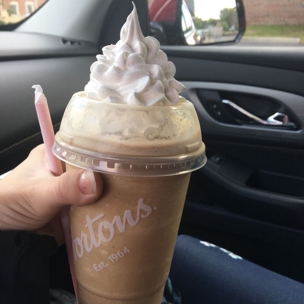 Tim Hortons - a hand holding a cup of coffee - Bakeries Near Me - Monroe, Michigan Tim Hortons - a hand holding a cup of coffee - Bakeries Near Me - Monroe, Michigan
