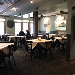 22 North Restaurant - Carpet looks as though it's 30 years old; food scraps beneath the table in the center of the frame.  Needs an extreme makeover!