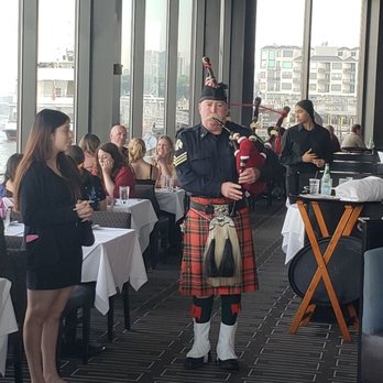 Chart House - NY Fire fighter playing the pipes for my wife - Seafood Near Me - Weehawken, New Jersey