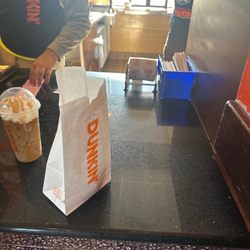 Dunkin' - The lady in the back was the one touching her stomach and hair and lower back