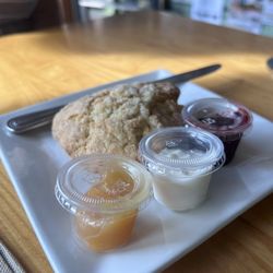 Claddagh Coffee - Scone with lemon curd, cream, and raspberry jam