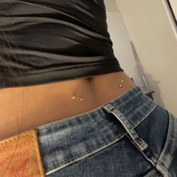 Cholo Pierces And Tattoo Studio - Surface back piercings