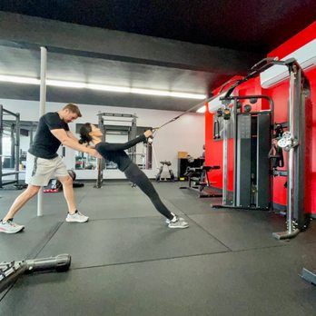 So Fit SoCal - Coach watching form during a trx row. - Trainers Near Me - Arcadia, California So Fit SoCal - Coach watching form during a trx row. - Trainers Near Me - Arcadia, California