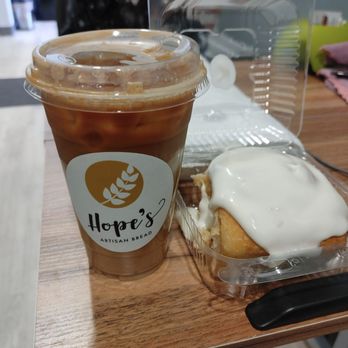 Proof Artisan Bread - Iced Pistachio Milk Latte and a sourdough cinnamon roll. - Bakeries Near Me - Litchfield Park, Arizona Proof Artisan Bread - Iced Pistachio Milk Latte and a sourdough cinnamon roll. - Bakeries Near Me - Litchfield Park, Arizona